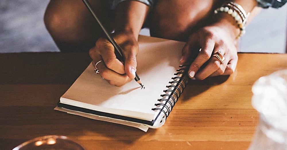 Hand writing on a notepad