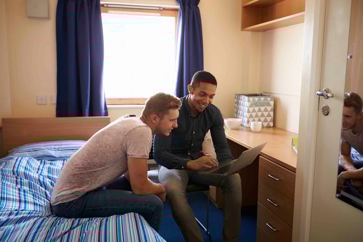 Looking at laptop together in dorm