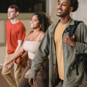 Three students walking the hall