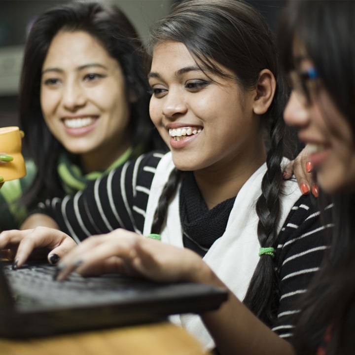 Three girls on laptop