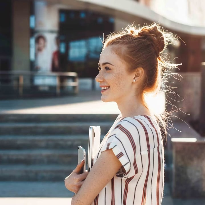 Person smiling outdoors